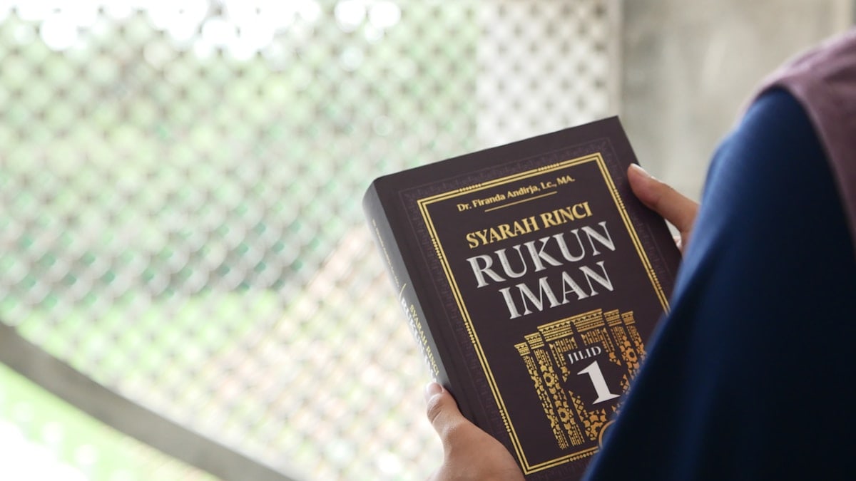 a person holding a book in their hands